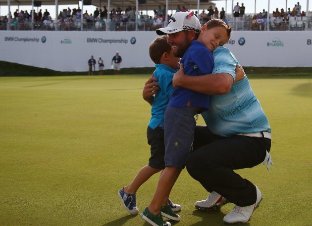 Marc Leishman celebrates with sons Oliver and Harry after winning the BMW Championship.