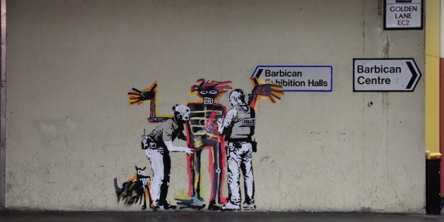 One of two new murals painted by the artist Banksy near the Barbican Centre in London. The works mark the opening of an exhibition by American artist Jean-Michel Basquiat at the arts venue.