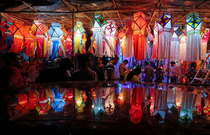 Customers shop for lanterns at a roadside Diwali market in Mumbai.