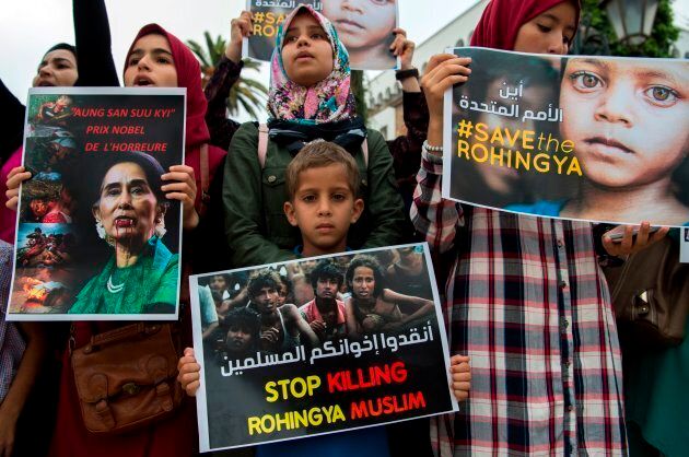Moroccans, some of them holding placards depicting Nobel Peace Prize winner Aung San Suu Kyi, take part in a protest condemning a crackdown on Rohingya Muslims in Myanmar.