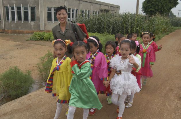 Children prepare for a performance in Onchon County near Pyongyang, North Korea.