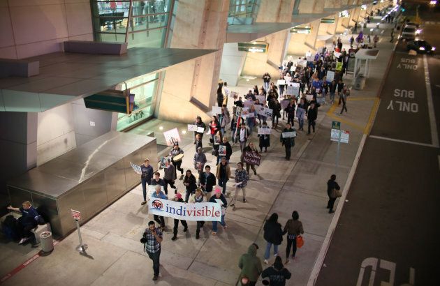 Protesters chant during a rally against the travel ban at San Diego International Airport.