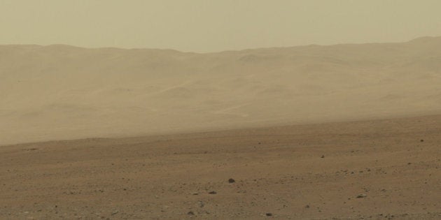 This color image from NASA's Curiosity rover shows part of the wall of Gale Crater, the location on Mars where the rover landed on Aug. 5, 2012 PDT. This area has been known and studied since the 1970s beginning with NASA's Viking missions.