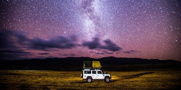Sani Pass, Lesotho -car sets up camp for the evening beneath the stars.