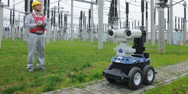 CHUZHOU, CHINA - JUNE 06: (CHINA OUT) Two robots inspect the equipment in a 220kV electrical substation on June 6, 2016 in Chuzhou, China. The robots possess an infrared thermal imager and a visual light camera, thereby giving them the ability to replace 24-hour manual inspection. With the arrival of the national college entrance exam, Chuzhou's power company uses the robots to improve efficiency, ensure quality and guarantee the safety of the power supply during the exam period. (Photo by VCG/VCG via Getty Images)