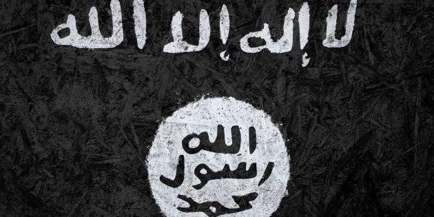Islamic State of Iraq and the Levant flag on the concrete texture
