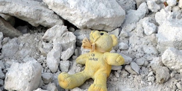 IDLIB, SYRIA - OCTOBER 24: A toy lying on the wreckage of a building is seen after the war crafts belonging to the Syrian Army bombed the Qefr Teharim town of Idlib, Syria on October 24, 2016. (Photo by Mohammed Jbas/Anadolu Agency/Getty Images)