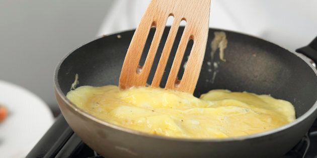 Omelette being cooked in a frying pan, close up