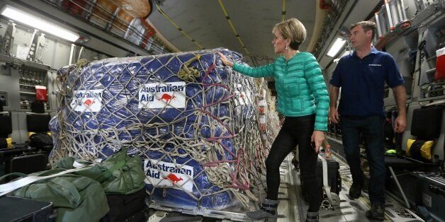 Minister for Foreign Affairs Julie Bishop inspects aid supplies on a RAAF plane bound for Fiji after Tropical Cyclone Winston