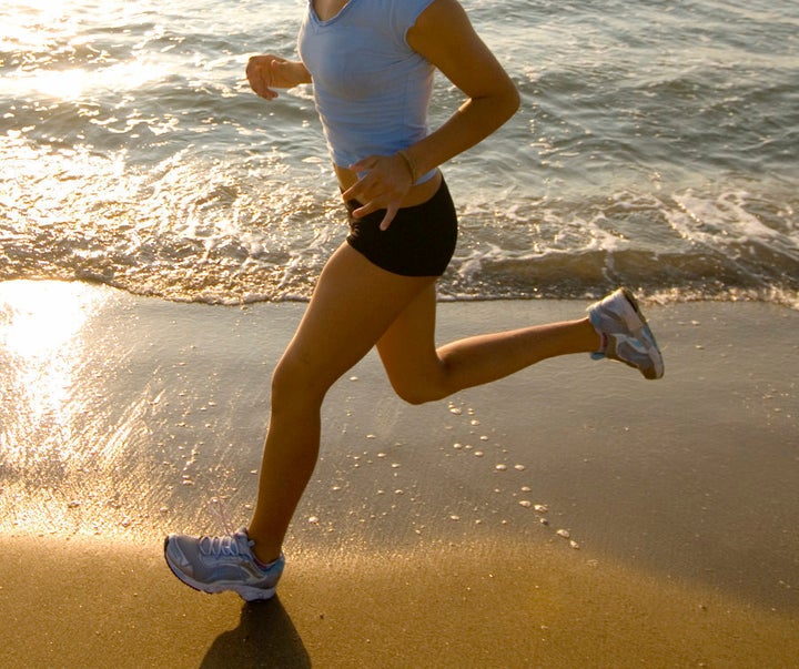 Shoes on the hard, wet sand is okay but be careful in the dry, soft sand as you can easily roll your ankle.