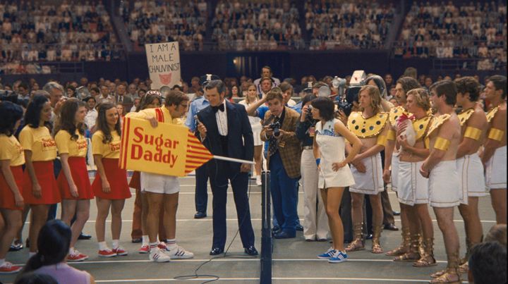 The film expertly recreated details from the actual events including Riggs' Sugar Daddy sponsorship, and the shirtless men who carried King out onto the court.