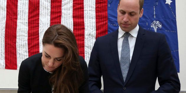 Will and Kate write a message of condolences at the U.S. Embassy in London.