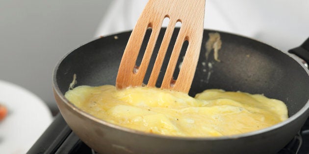 Omelette being cooked in a frying pan, close up