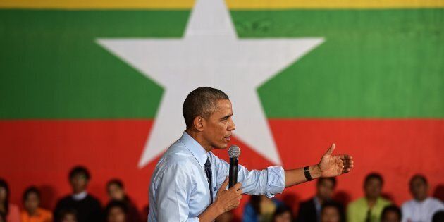 Former US President Barack Obama speaks at a Young Southeast Asian Leaders Initiative (YSEALI) town hall meeting at Yangon University's Diamond Jubilee Hall in Yangon on November 14, 2014.