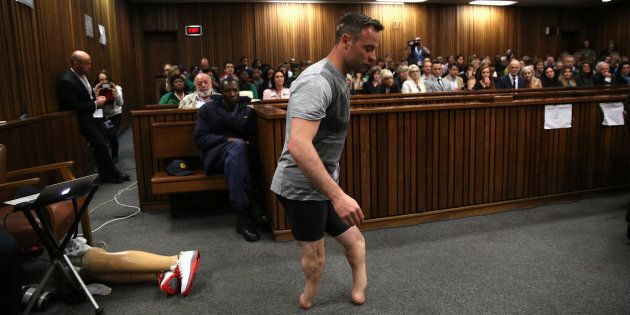 Paralympic gold medalist Oscar Pistorius walks across the courtroom without his prosthetic legs during the third day of the resentencing hearing for the 2013 murder of his girlfriend Reeva Steenkamp, at Pretoria High Court, South Africa June 15, 2016. REUTERS/Siphiwe Sibeko