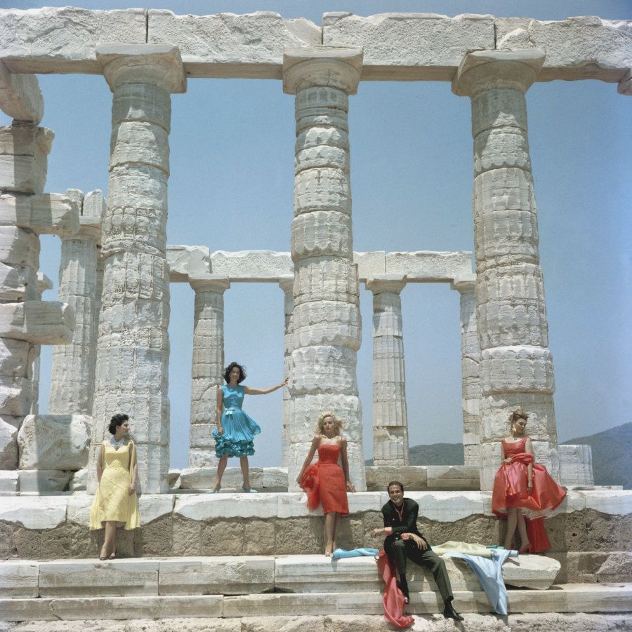 Greek fashion designer Dimitris Kritsas poses with four models against a backdrop of the ancient Doric temple to Poseidon at Sounion, July 1967.