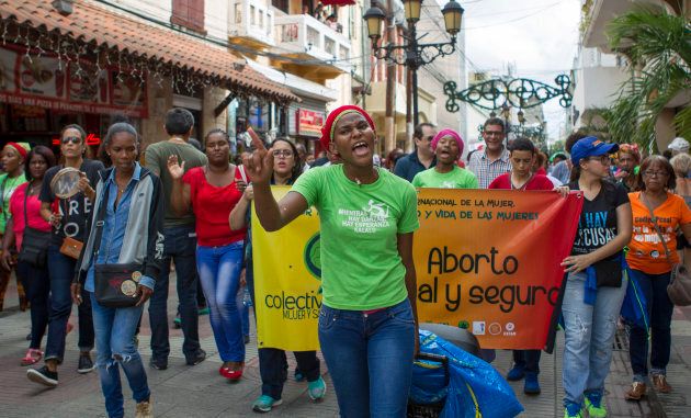 People take part in a march demanding the Dominican President not criminalise abortion in Santo Domingo on December 18, 2016. Dominican Republic has one of the highest rates of maternal mortality, largely associated with clandestine abortions performed in unsafe conditions -third cause of maternal death- and which mainly affects women living in poverty.