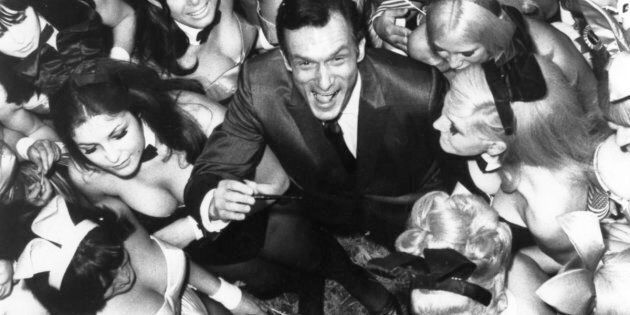 Hugh Hefner surrounded by 50 of his Playboy Bunnies on June 27, 1966, in London.