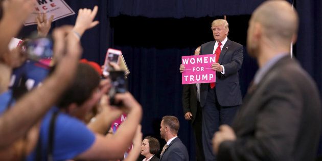 PHOENIX, AZ - OCTOBER 29: Republican presidential nominee Donald Trump holds a 'Women for Trump' sign during a campaign rally at the Phoenix Convention Center, his seventh visit to the state during this election season, October 29, 2016 in Phoenix, Arizona. The Federal Bureau of Investigation announced Friday it discovered emails pertinent to the closed investigation of Democratic presidential nominee Hillary Clinton's private email server and are looking to see if they improperly contained classified information. Trump said 'I think it's the biggest story since Watergate.' (Photo by Chip Somodevilla/Getty Images)