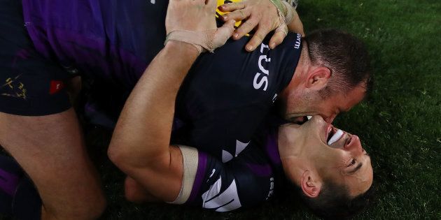 SYDNEY, AUSTRALIA - OCTOBER 01: Billy Slater of the Storm and Cameron Smith of the Storm celebrate winning the 2017 NRL Grand Final match between the Melbourne Storm and the North Queensland Cowboys at ANZ Stadium on October 1, 2017 in Sydney, Australia. (Photo by Cameron Spencer/Getty Images)