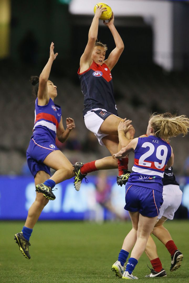 Ebony-Rose Antonio of the Demons takes a screamer during a Women's AFL exhibition match in August.