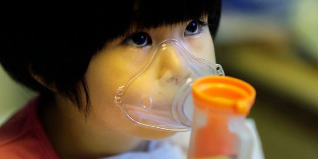 A two year old in Beijing receives nebuliser therapy during a pollution 'red alert' in 2015.