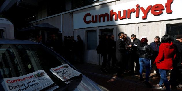 Journalists stand in front of the headquarters of Cumhuriyet newspaper, an opposition secularist daily, in Istanbul, Turkey, October 31, 2016. REUTERS/Murad Sezer