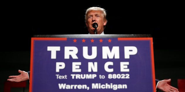 Republican presidential nominee Donald Trump appears at a campaign rally in Warren, Michigan U.S. October 31, 2016. REUTERS/Carlo Allegri
