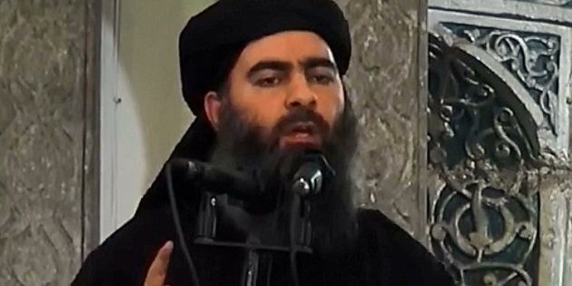 MOSUL, IRAQ - JULY 5 : An image grab taken from a video released on July 5, 2014 by Al-Furqan Media shows alleged Islamic State of Iraq and the Levant (ISIL) leader Abu Bakr al-Baghdadi preaching during Friday prayer at a mosque in Mosul.(Photo by Al-Furqan Media/Anadolu Agency/Getty Images)