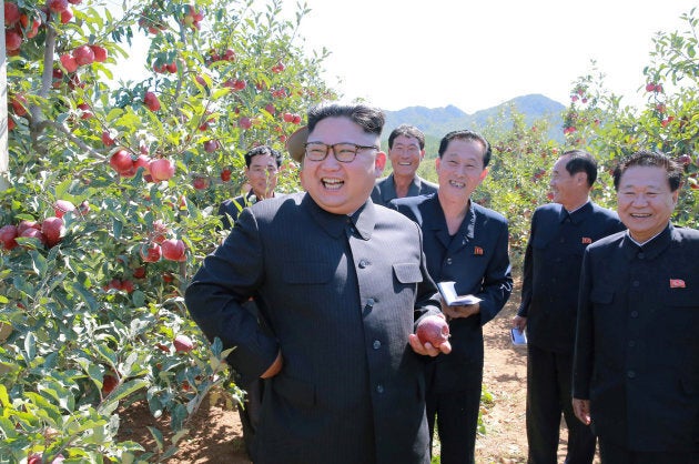 North Korean leader Kim Jong Un gives field guidance during a visit to a fruit orchard in Kwail county.