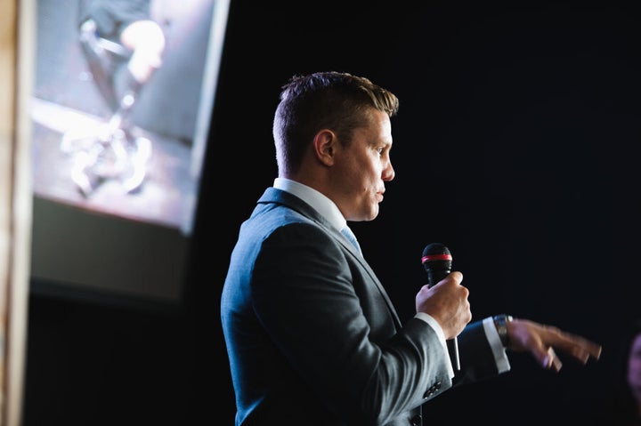 Damien speaking at his book launch, 'Without Warning.'