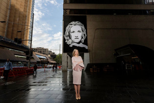 Domestic abuse advocate Felicity Cook is pictured in front of a new mural unveiled in Sydney on Monday.