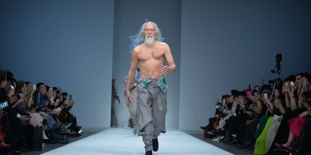 Wang Deshun struts a runway in 2015. 