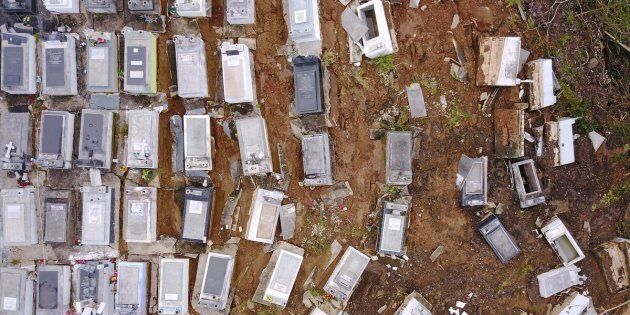 Coffins were washed downhill from the Lares Municipal Cemetery by a landslide in the wake of Hurricane Maria in Puerto Rico.
