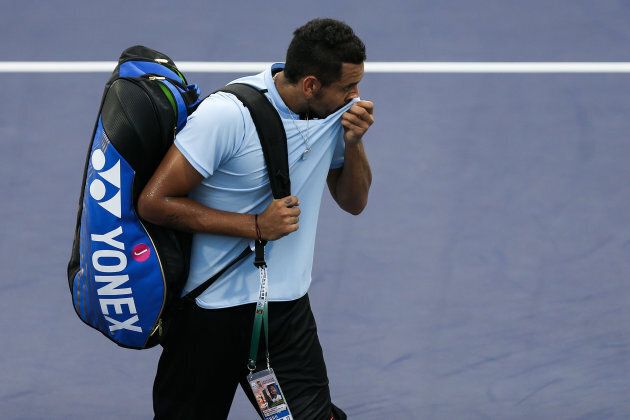 Nick Kyrgios leaves the court after retiring from the Men's singles match against Steve Johnson at the Shanghai Rolex Masters.