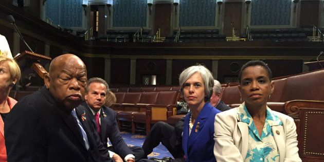 A photo tweeted from the floor of the U.S. House by Rep. Donna Edwards (R) shows Democratic members of the U.S. House of Representatives, including herself and Rep. John Lewis (L) staging a sit-in on the House floor
