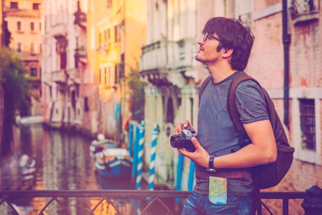 Young man travelling in Venice, Italy