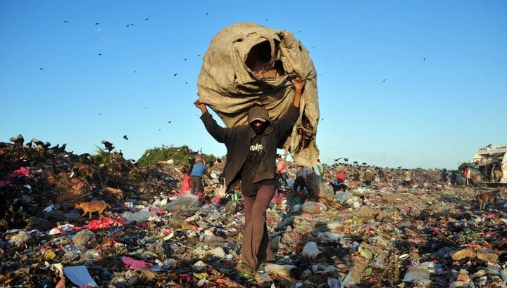 People collect plastics and metals to be sold for recycling, at Managua's landfill 'La Chureca'.