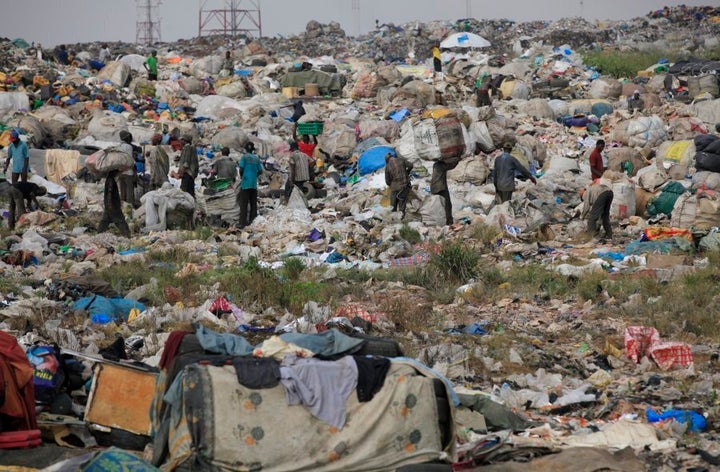 Scavengers in Lagos, Nigeria sort out iron and plastic to sell at the Olusosun dump site the city's largest dump.