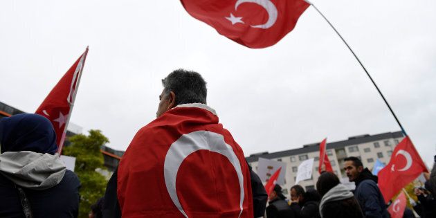 Turkish flags during a protest meeting outside the Bredangsskolan school in southern Stockholm, Sweden, October 15, 2015, following the cancellation of the panel 'July 15th - Behind the Scene of the Bloody Coup' about the July coup attempt in Turkey. Henrik Montgomery/TT News Agency/via Reuters ATTENTION EDITORS - THIS IMAGE WAS PROVIDED BY A THIRD PARTY. FOR EDITORIAL USE ONLY. NOT FOR SALE FOR MARKETING OR ADVERTISING CAMPAIGNS. THIS PICTURE IS DISTRIBUTED EXACTLY AS RECEIVED BY REUTERS, AS A SERVICE TO CLIENTS. SWEDEN OUT. NO COMMERCIAL OR EDITORIAL SALES IN SWEDEN. NO COMMERCIAL SALES.