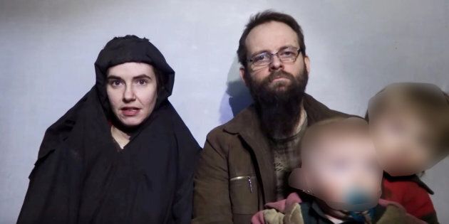 A still image from a video posted by the Taliban on social media on December 19, 2016 shows American Caitlan Coleman (L) speaking next to her Canadian husband Joshua Boyle and their two sons. Courtesy Taliban/Social media via REUTERS