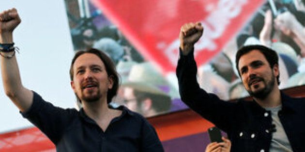Podemos (We Can) leader Pablo Iglesias (L) and Izquierda Unida (United Left) leader Alberto Garzon.
