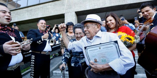 Fabio Alvarado, 91, originally from El Salvador and who was sworn in as a U.S. citizen on election day, arrives with his wife Marta, 80, to vote in the U.S. presidential election at LA County Registrar's office in Norwalk, California, U.S., November 8, 2016. REUTERS/Mario Anzuoni TPX IMAGES OF THE DAY