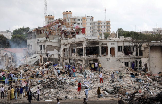 Somali government forces and civilians gather at the scene of an explosion in KM4 street in the Hodan district of Mogadishu, Somalia October 15, 2017.