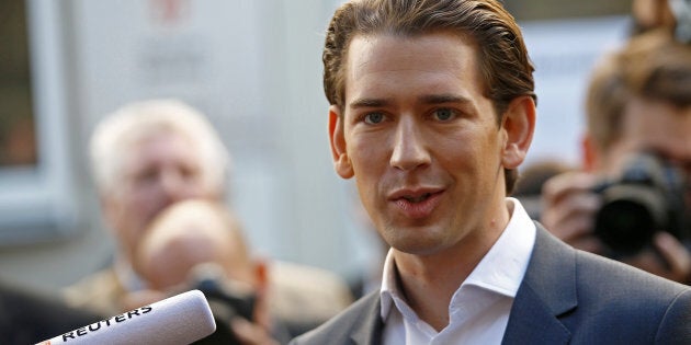 Top candidate of Peoples Party (OeVP) and Foreign Minister Sebastian Kurz talks with journalists after leaving a polling station in Vienna, Austria October 15, 2017. REUTERS/Leonhard Foeger TPX IMAGES OF THE DAY