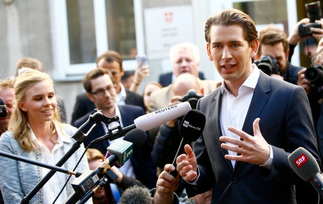 Top candidate of Peoples Party (OeVP) and Foreign Minister Sebastian Kurz talks with journalist after leaving a polling station in Vienna, Austria October 15, 2017.