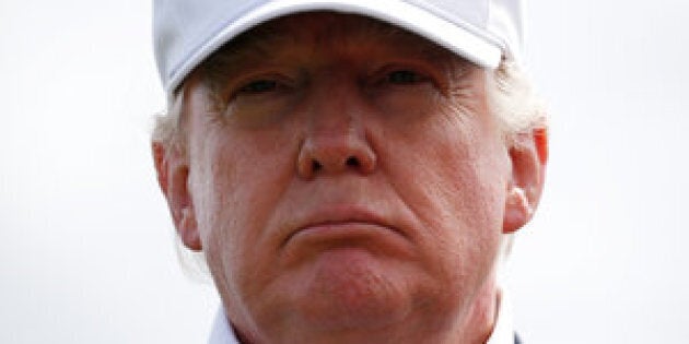 Republican presidential candidate Donald Trump speaks to the media on the golf course at his Trump International Golf Links in Aberdeen, Scotland, June 25, 2016. REUTERS/Carlo Allegri