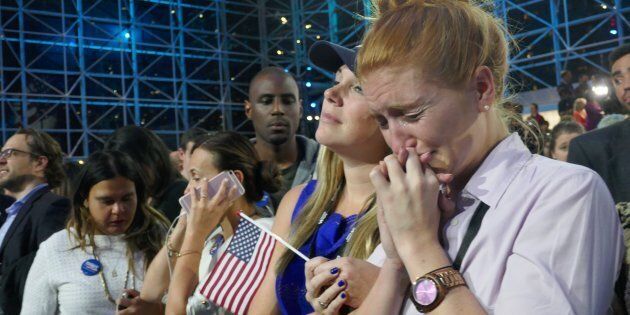 Democratic Party's presidential nominee Hillary Clinton's supporters show their sorrow as the results indicate the Republican Party's presidential nominee Donald Trump's victory for the 2016 Presidential Elections at Jacob K. Javits Convention Center in New York.