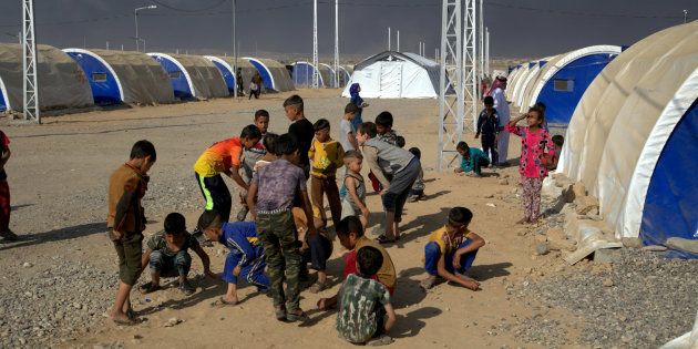 Save the Children teams put up a tented temporary learning space in Jad'ah camp, south of Mosul.