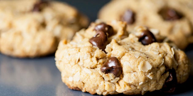 Macro view of warm chocolate chip cookie, focus on chocolate chips